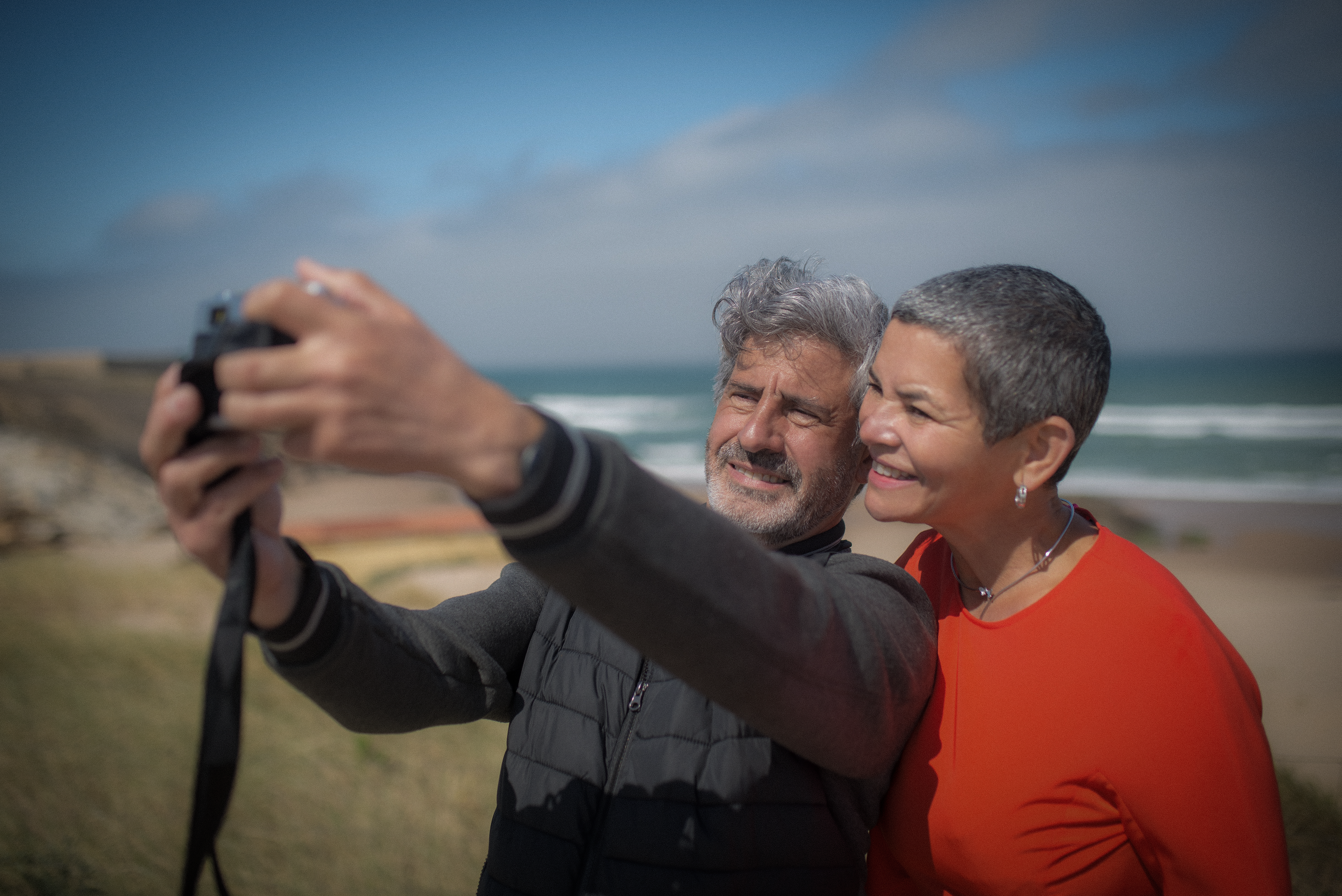 Couple taking selfie on the beach